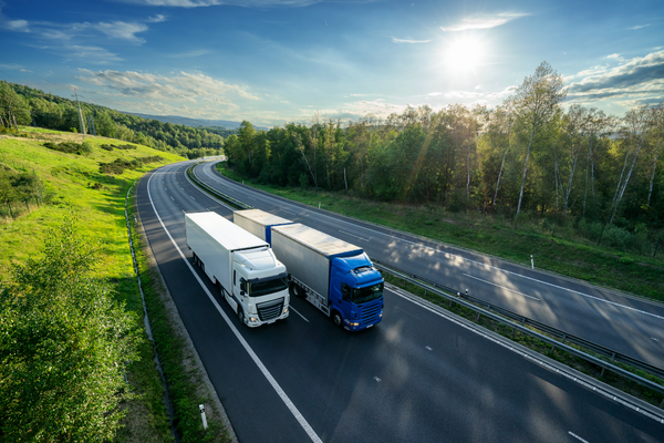 62fbbc3ee846b67820ed003f_Two Trucks Driving